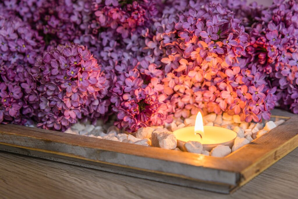 Purple Flowers with candles and rocks