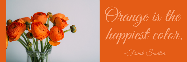 Orange is the happiest color quote and a vase of orange flowers