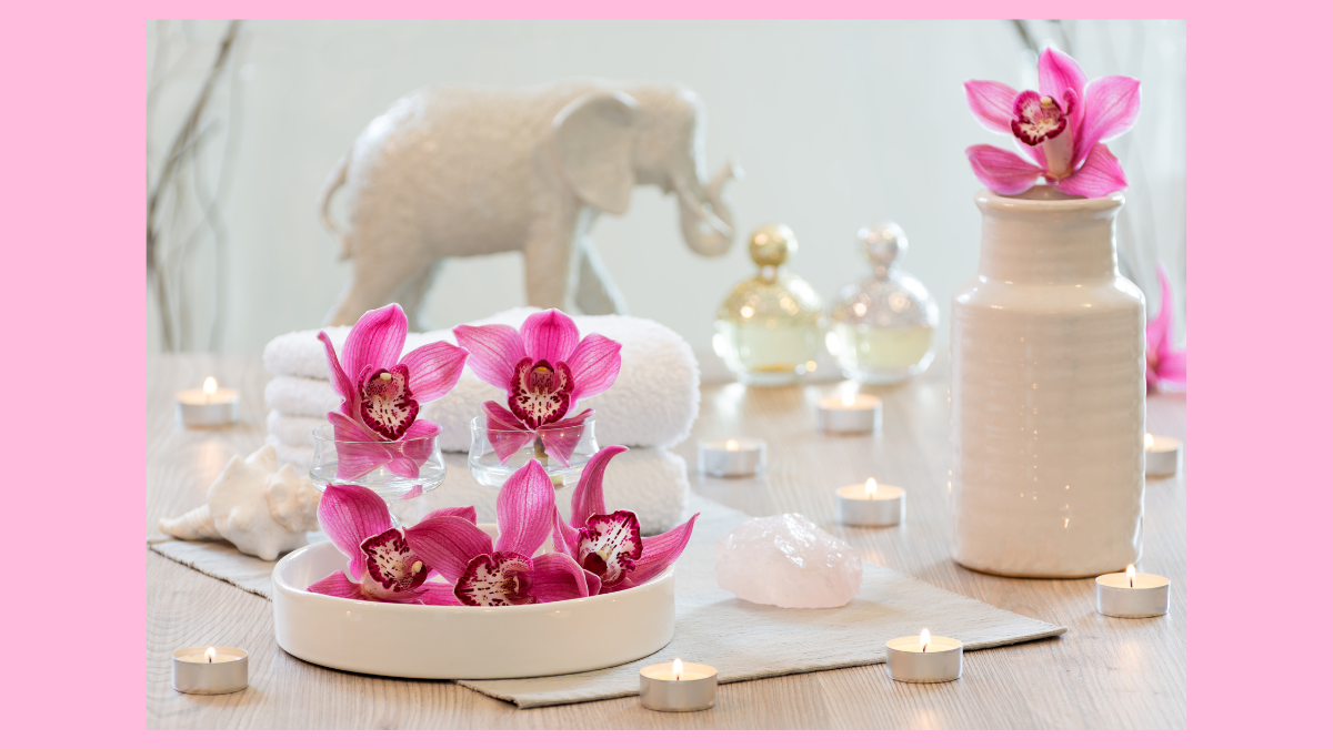 Pink orchids, rose quartz, candles and Earth element decor representing the Feng Shui Relationship Gua.
